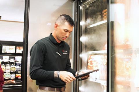 person in front of refrigerator