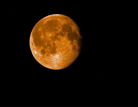 Harvest Moon in a dark night sky