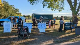 City staff and community members gather in a park to discuss improvements