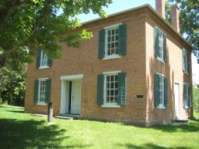 Image of the historic Pond House in summer