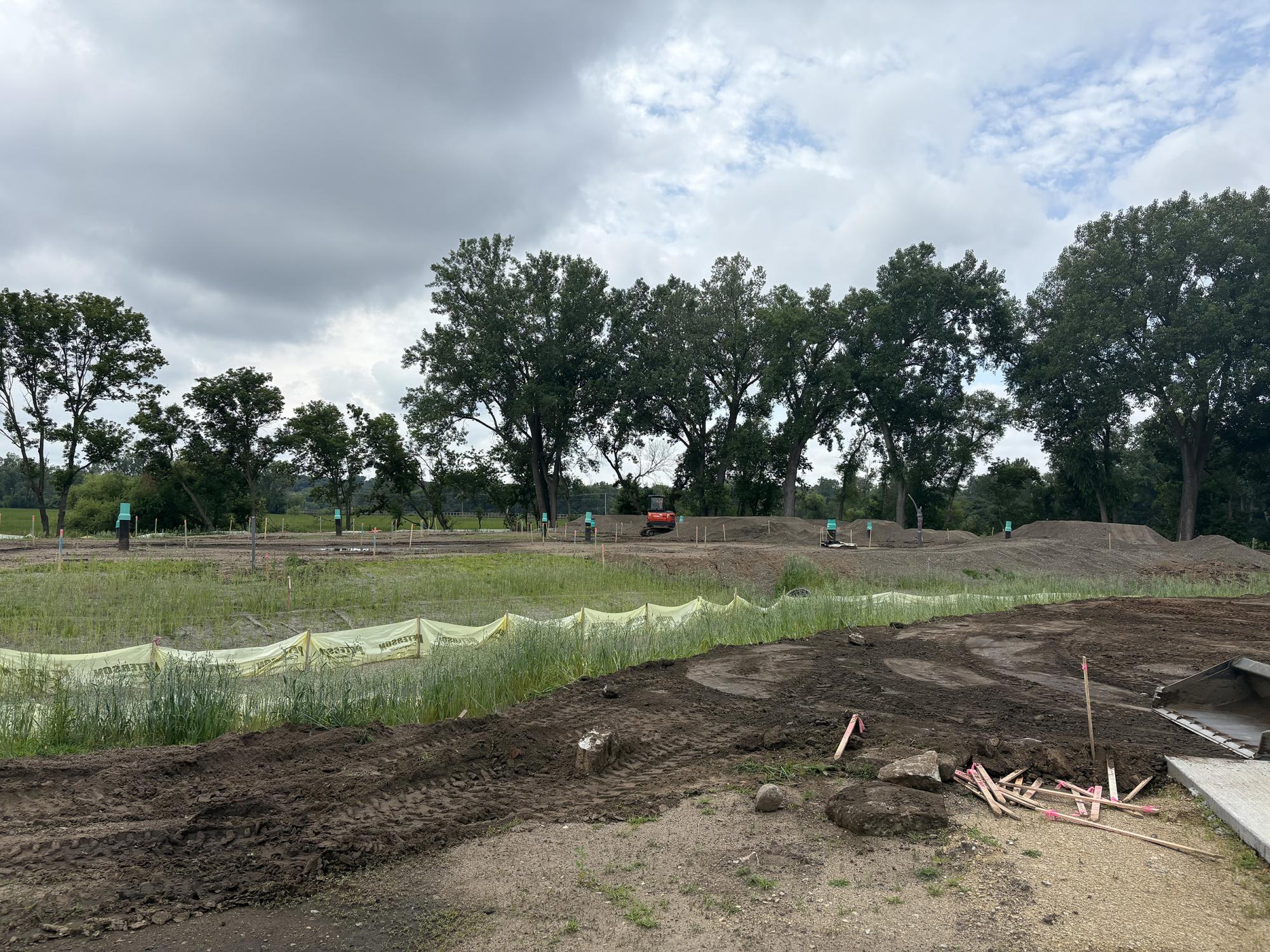Silt fence with ongoing work at Tretbaugh bike skills park