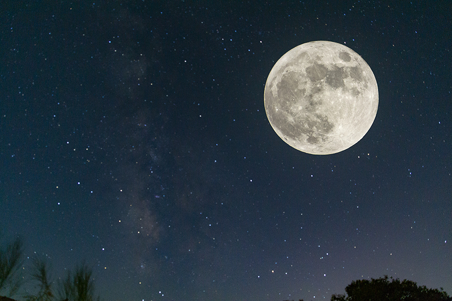 Night sky with large full moon upper right