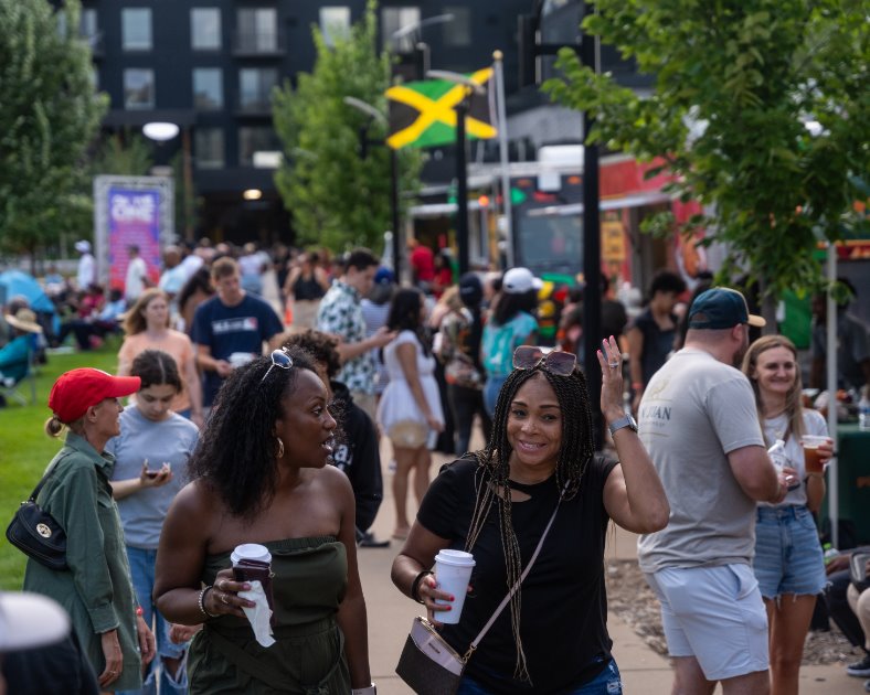 Smiling people enjoying On The One Music Festival