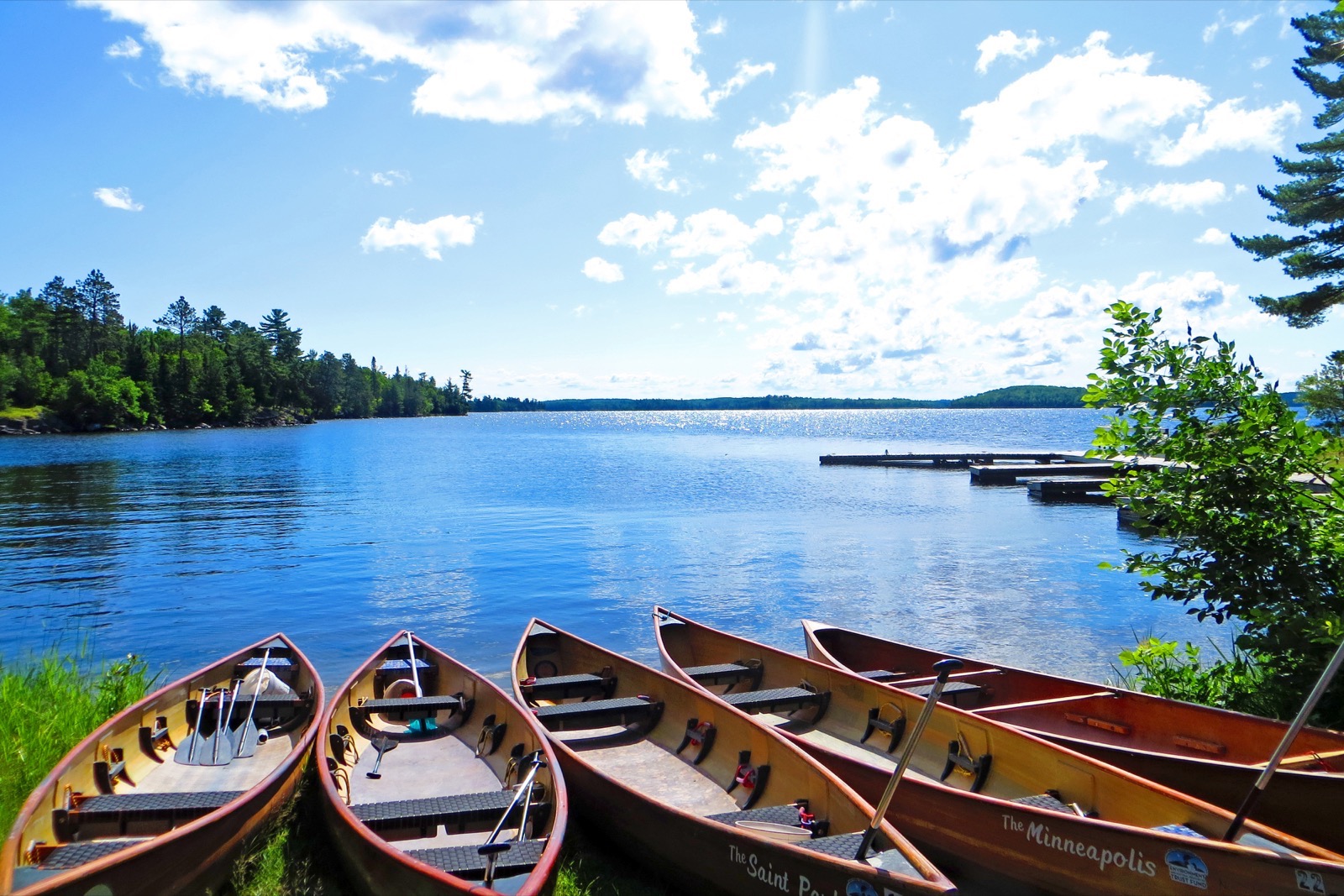 Wilderness Inquiry canoes lined up at a lake in Voyageurs National Park
