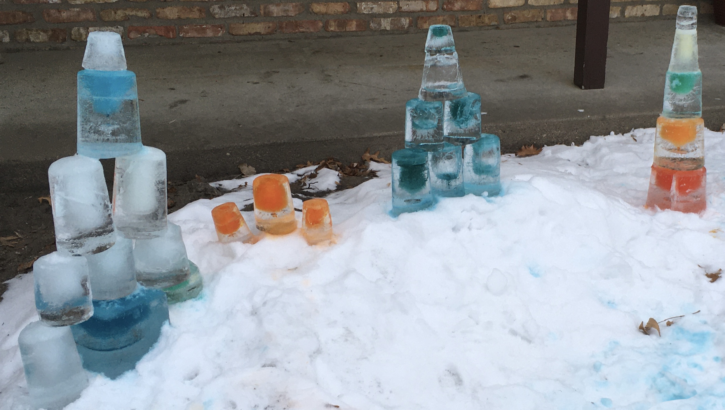 Colorful ice blocks stacked in snow