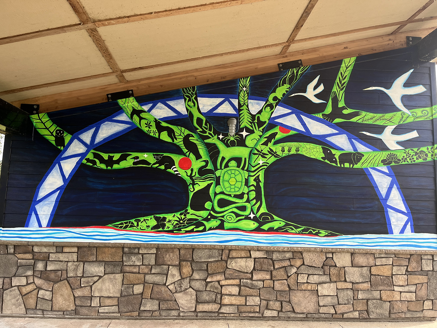 Colorful mural on slanted wall