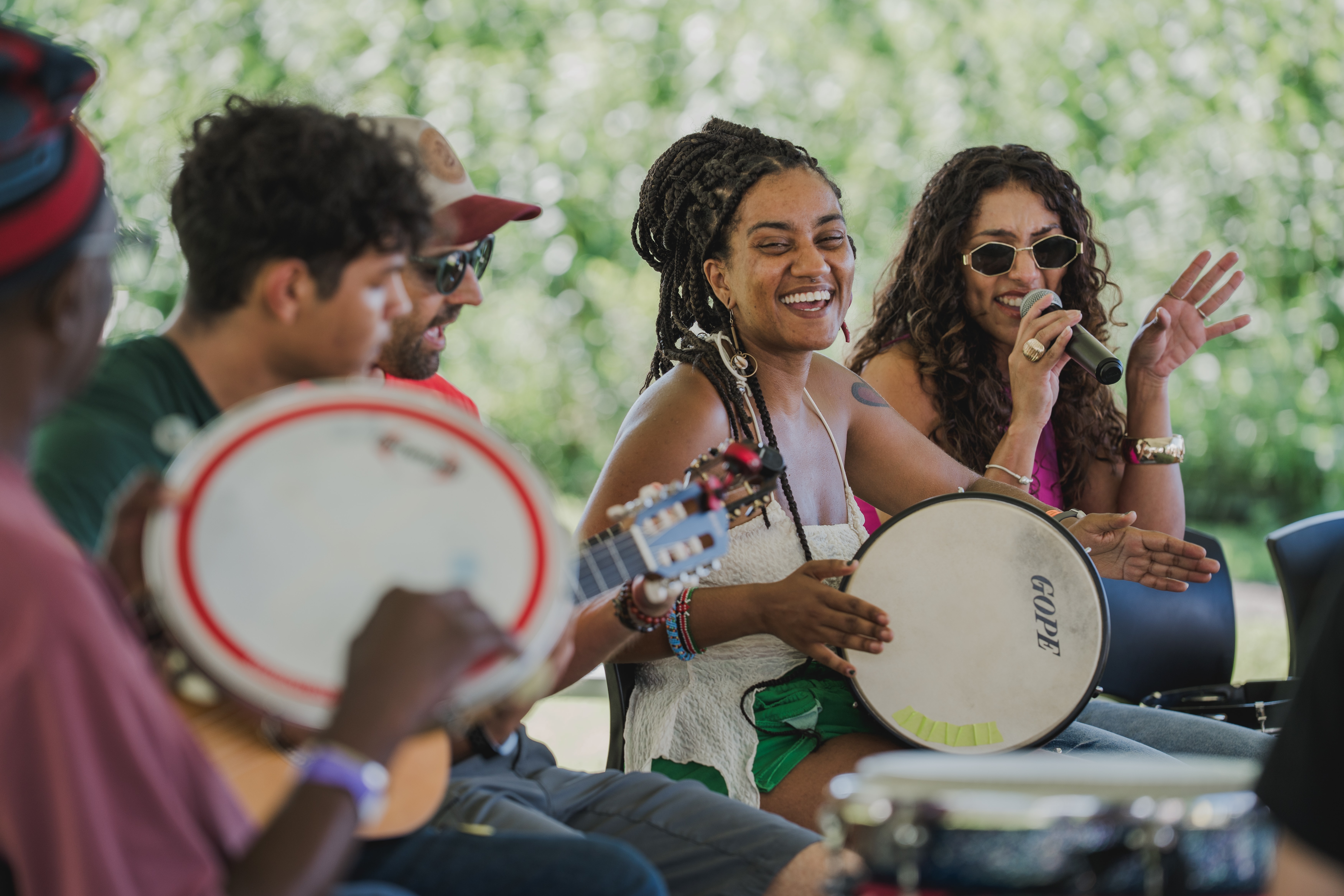 People playing drums and singing