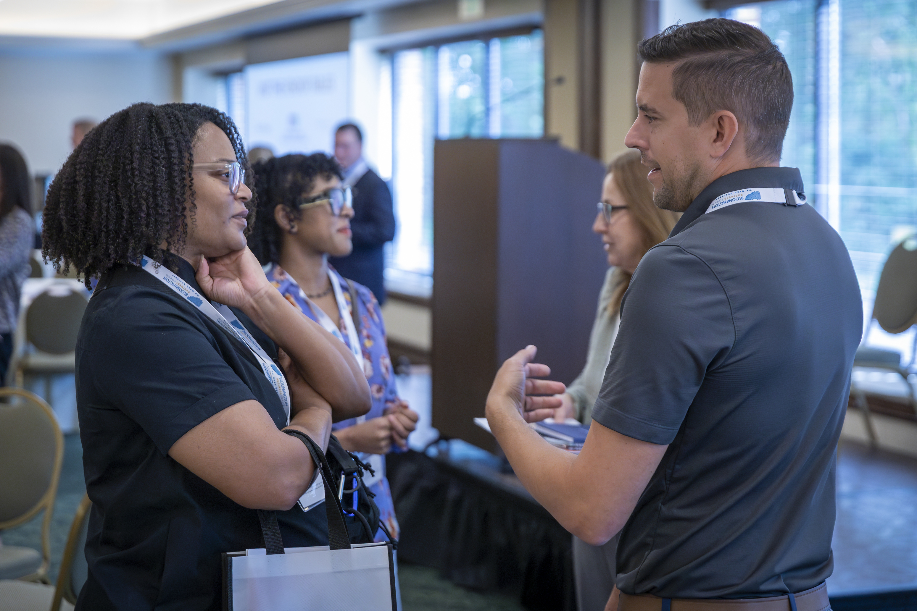 Two business owners chatting at the Bloomington Business Forum 