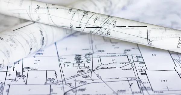 decorative image of generic planning maps spread upon a table