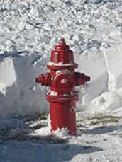 Fire hydrant surrounded by snow