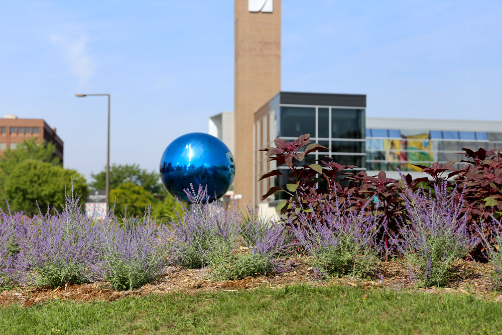 South Loop area landscaping project with blue mirror ball.