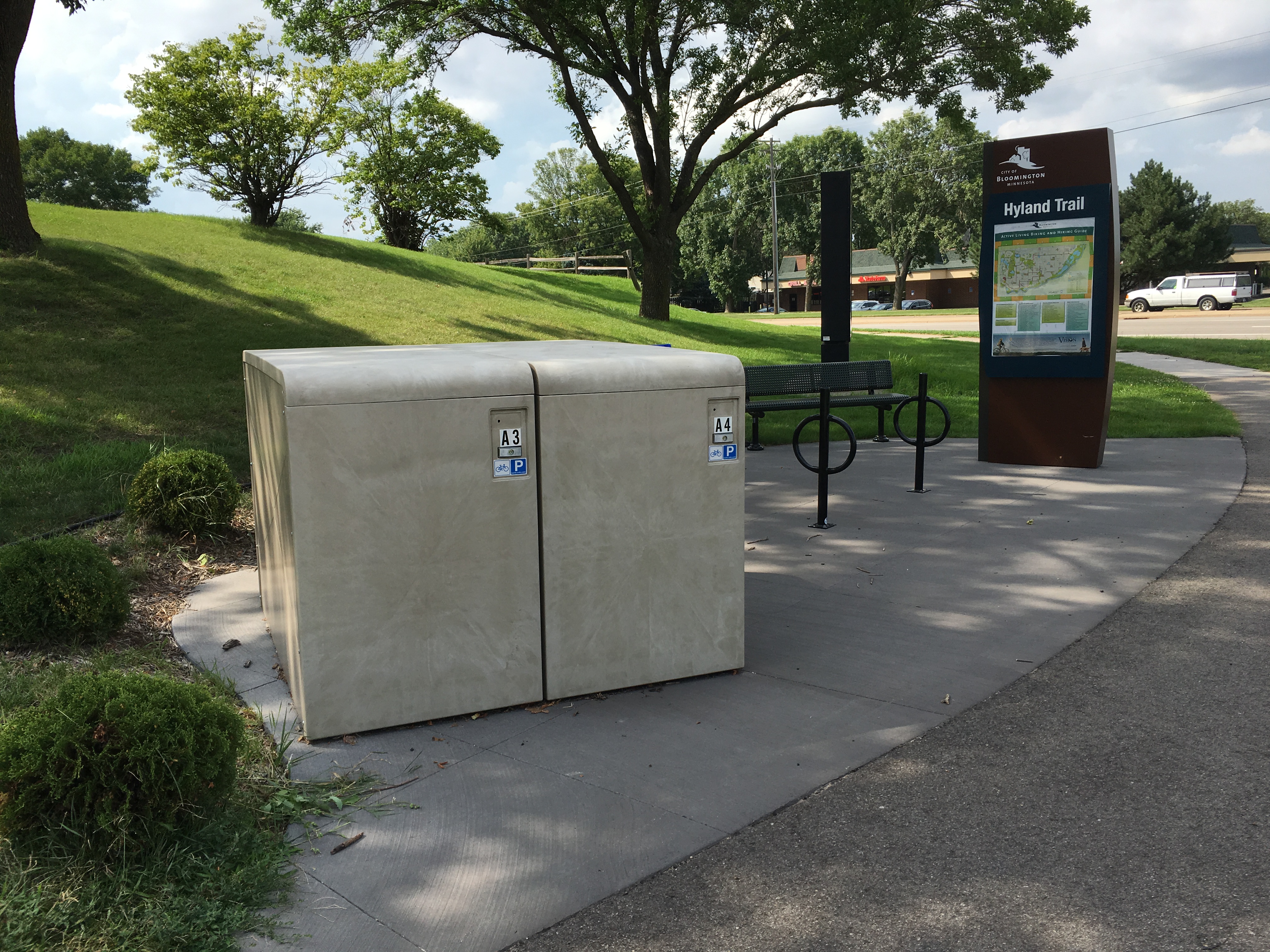 Hyland Trail signage in place at a street corner. 