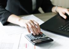 Person doing finances. (c) BigStockPhoto.