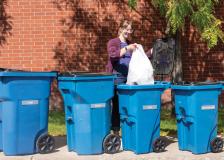 Bloomington employee throwing away trash