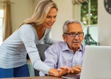 Man learning to use a laptop