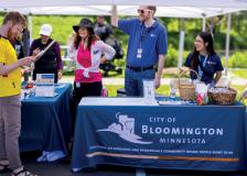 Finance employees tabling a city event