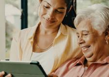 Woman learning to use tablet