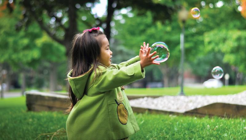 Child chasing a bubble