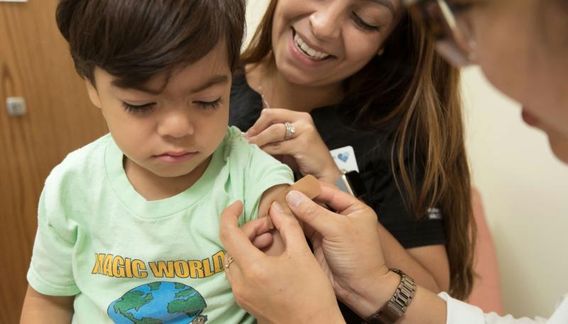 Young child getting vaccination