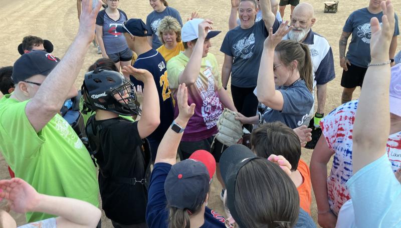 Adaptive athletes celebrating after a softball game