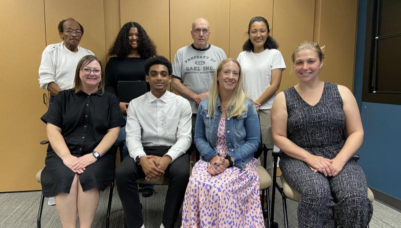 The Human Rights Commissioners pose and smile for the picture.