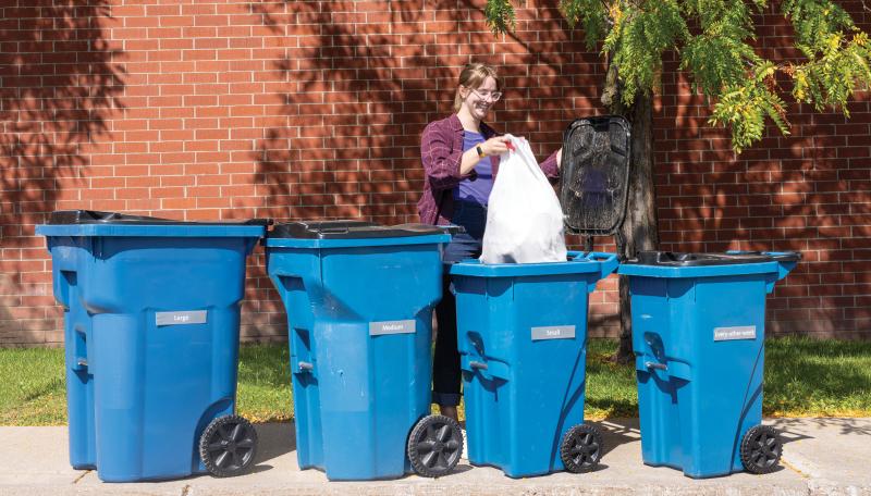 Bloomington employee throwing away trash