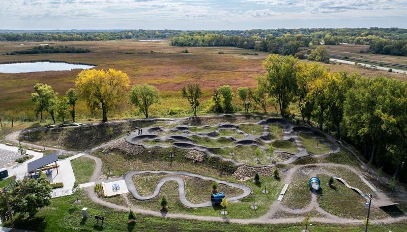 Bird's Eye view of Tretbaugh Bike Skills Park showing paved and unpaved trails, paths and jumps