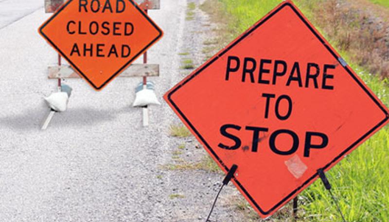 Road closed signs. ©BigStock.