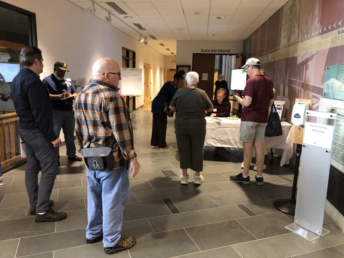 People waiting in line at check in table