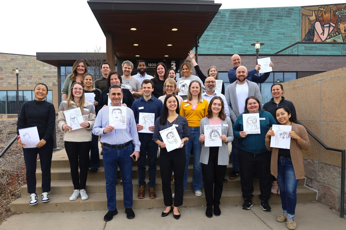 Members of the Bloomington Leadership Program pose in front of Bloomington Civic Plaza.
