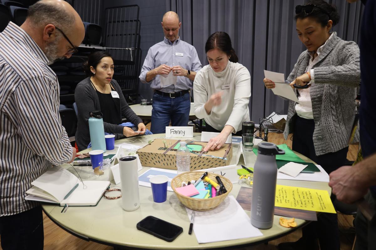 Members of the Bloomington Leadership Program work together on a "dream city" project.