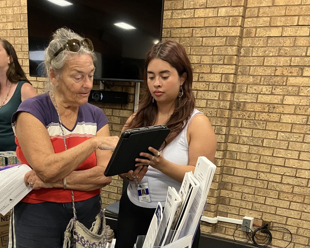 Person signing up for something on iPad