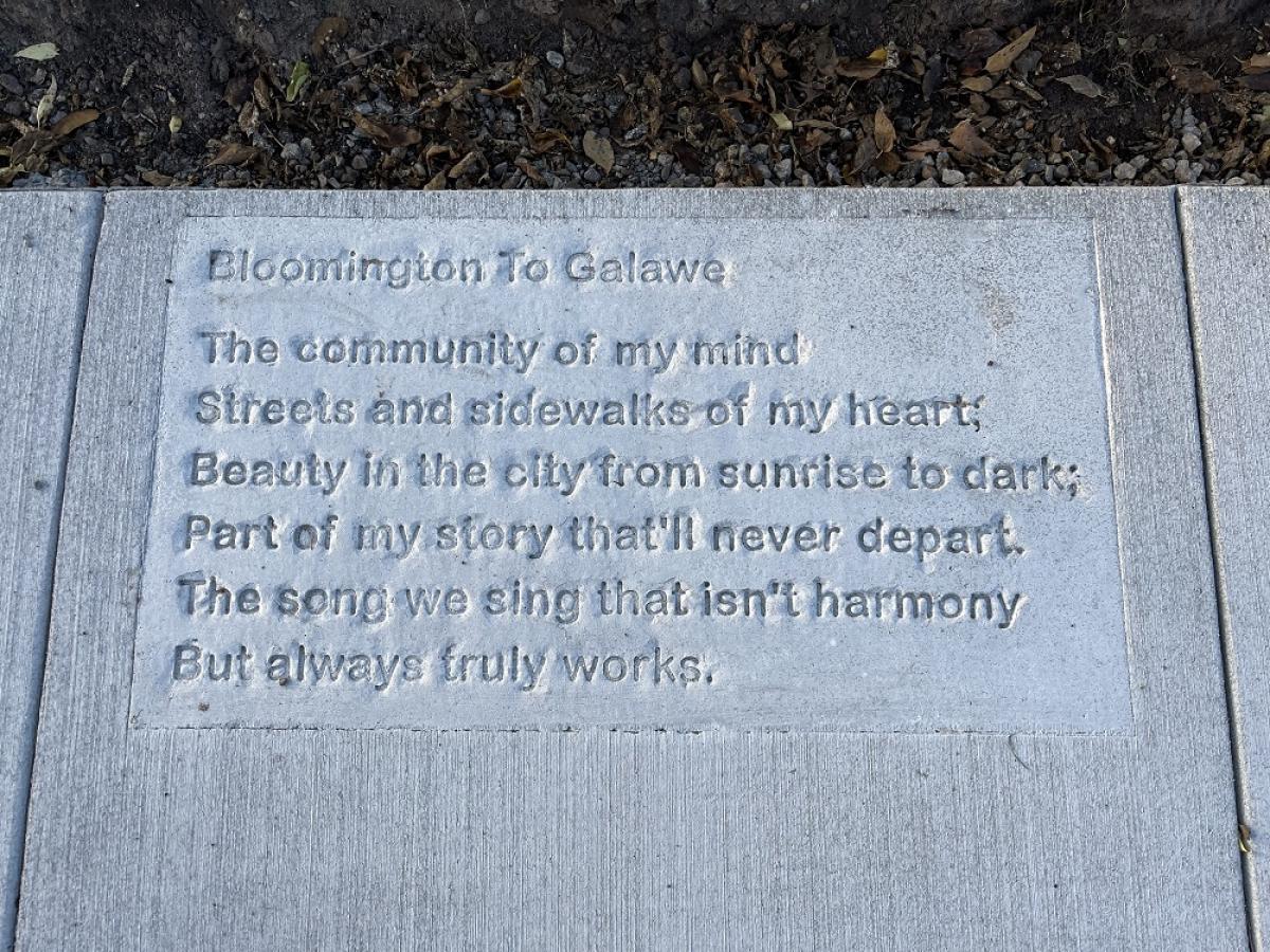 Poem stamped into a sidewalk. 