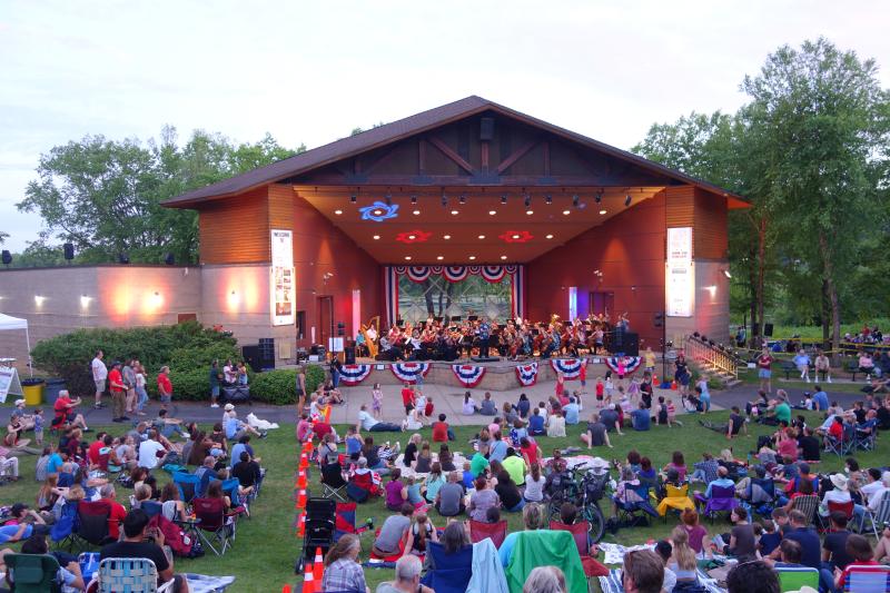 Large crowd enjoying Bloomington Symphony Orchestra performance at the Normandale Lake Bandshell during Summer Fete 2022