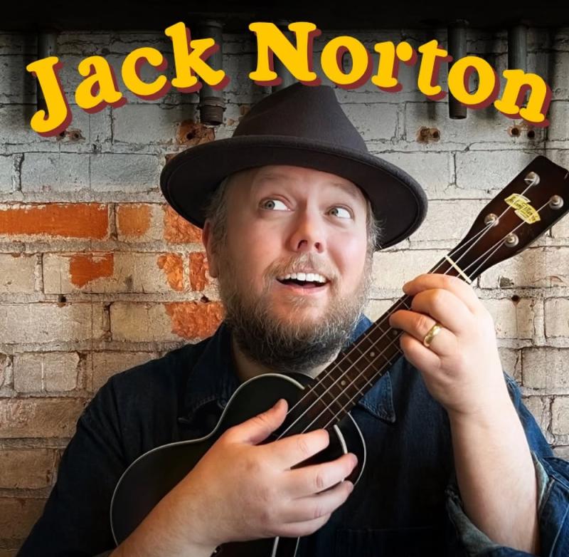 Entertainer Jack Norton wearing black hat and playing ukulele