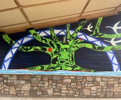 Mural in progress at Old Cedear Ave. Bridge - August 19, 2025