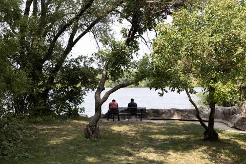 Normandale Lake with two men sitting on a bench