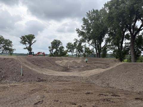Dip and ramp construction with heavy equipment at Tretbaugh bike skills park