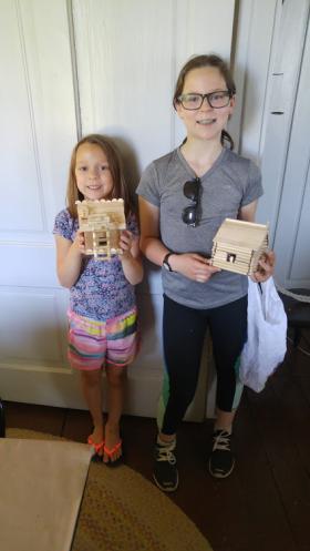 kids with mini log cabins