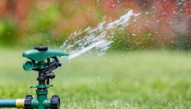 Water sprinkler on green grass