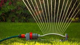 Water spraying from lawn sprinkler