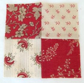 Red and white four-square quilt block