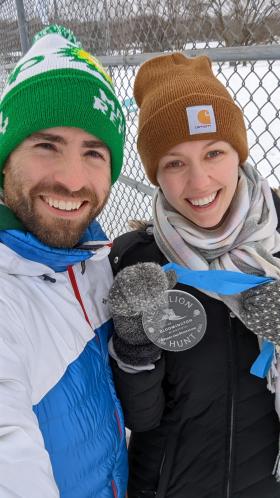 Medallion Hunt 2022 Winners Stephanie and Casey Auen holding the medallion 